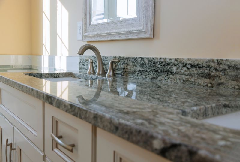 Bathroom vanity featuring granite